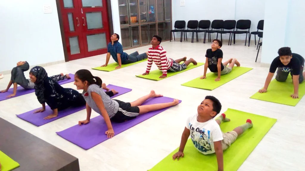 Dr. Naveen Raina, psychiatrist, life coach, and meditation practitioner, smiling in professional attire, representing holistic wellness, life coaching, and mental health guidance.