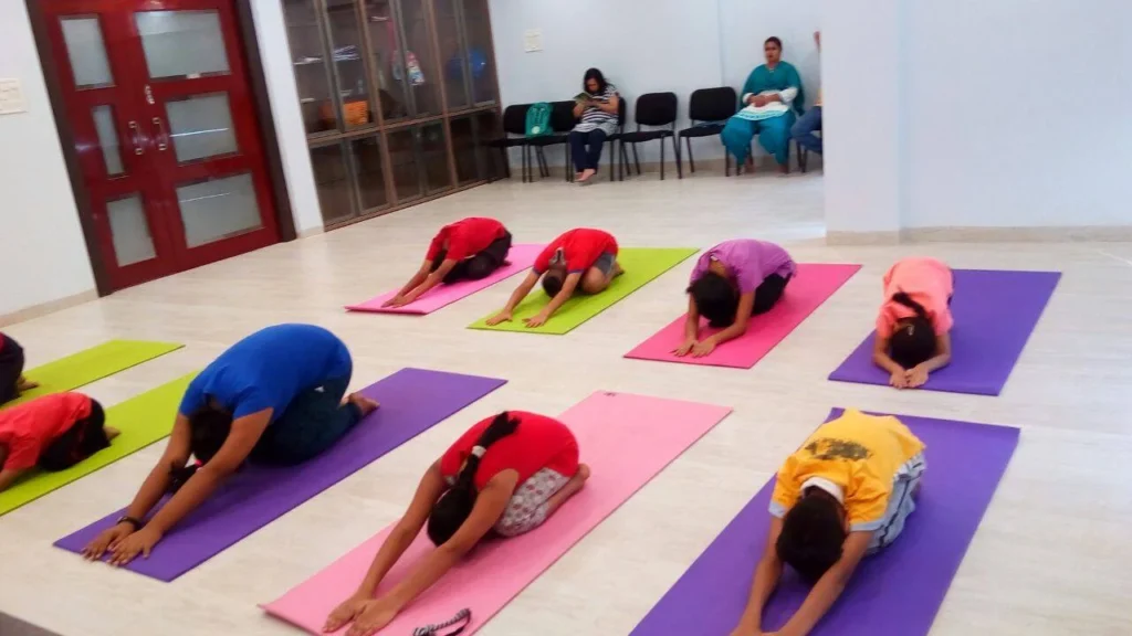 Dr. Naveen Raina, psychiatrist, life coach, and meditation practitioner, smiling in professional attire, representing holistic wellness, life coaching, and mental health guidance.