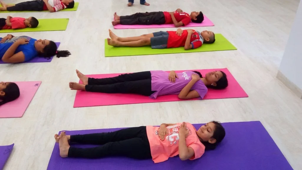 Dr. Naveen Raina, psychiatrist, life coach, and meditation practitioner, smiling in professional attire, representing holistic wellness, life coaching, and mental health guidance.