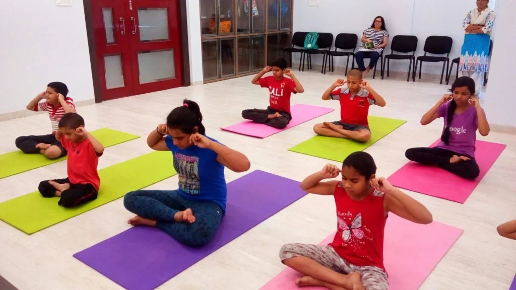 Dr. Naveen Raina, psychiatrist, life coach, and meditation practitioner, smiling in professional attire, representing holistic wellness, life coaching, and mental health guidance.