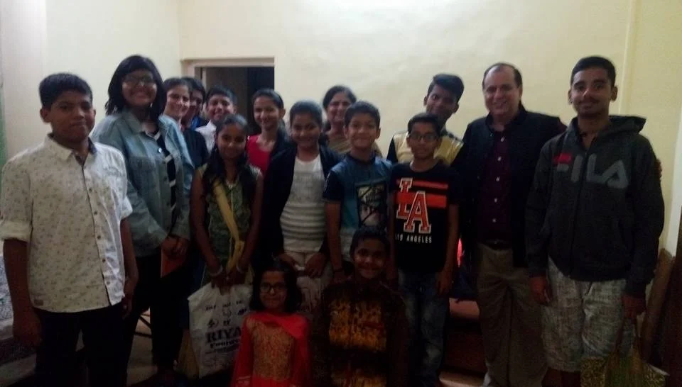 Dr. Naveen Raina, psychiatrist, life coach, and meditation practitioner, smiling in professional attire, representing holistic wellness, life coaching, and mental health guidance.