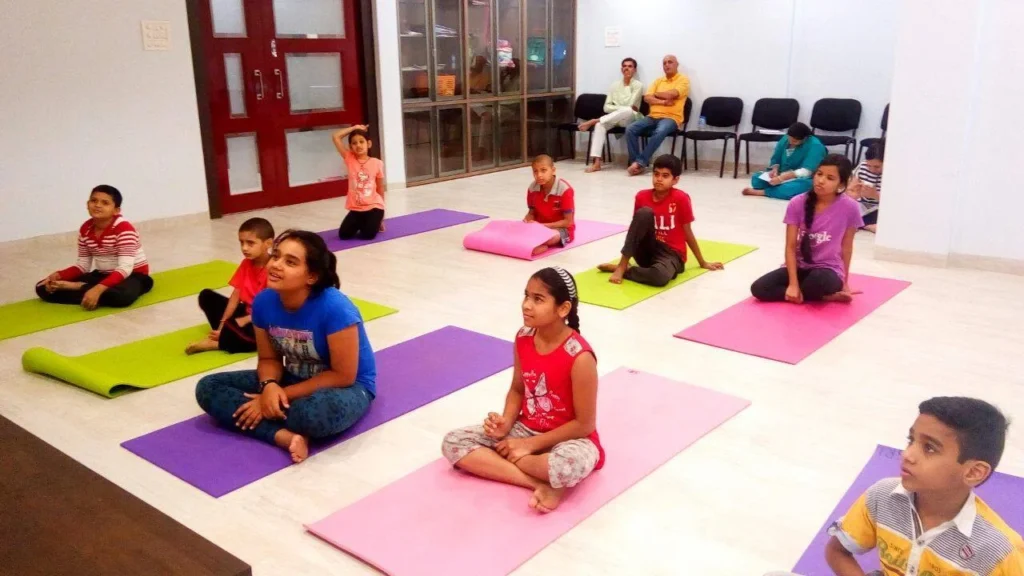 Dr. Naveen Raina, psychiatrist, life coach, and meditation practitioner, smiling in professional attire, representing holistic wellness, life coaching, and mental health guidance.