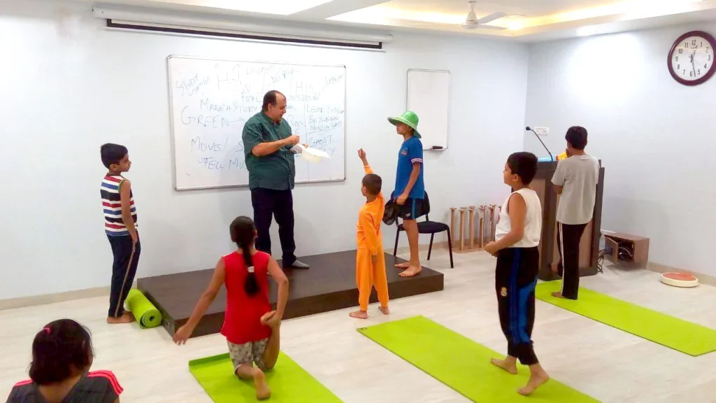 Dr. Naveen Raina, psychiatrist, life coach, and meditation practitioner, smiling in professional attire, representing holistic wellness, life coaching, and mental health guidance.